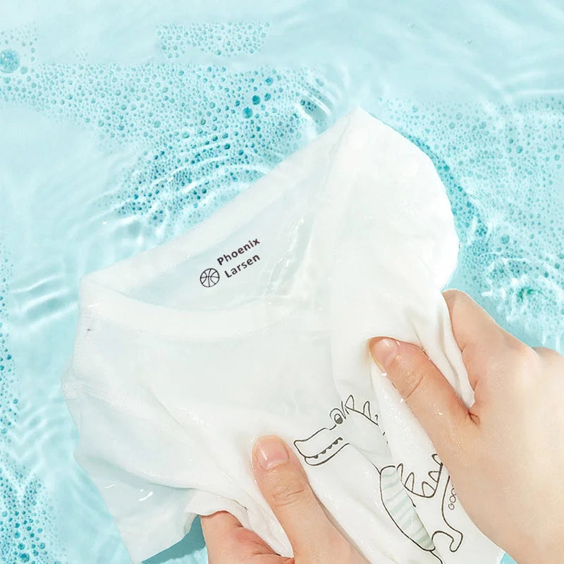 Washing of a white t-shirt with name stamp imprint in soap water